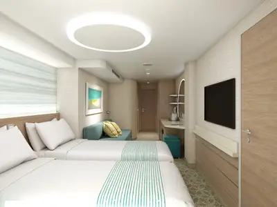 Moderne Balkonkabine auf der Carnival Celebration mit zwei Einzelbetten, Sofa, Schreibtisch und Fernseher. Helle Farben und indirekte Beleuchtung.