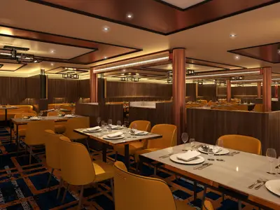Ein modernes Restaurant der Carnival Celebration mit warmem Ambiente. Es gibt gelbe Stühle, Holzwände und -trenner sowie elegant gedeckte Tische.