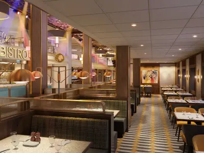 Innenansicht des eleganten Spezialitätenrestaurants Emeril's Bistro mit gemütlichen Sitzbänken, Tischen und einer Bar im Hintergrund.