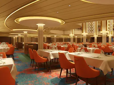 Weitwinkelansicht eines großen, eleganten Restaurants auf der Carnival Festivale. Zahlreiche Tische sind mit weißen Tischdecken, Besteck und Gläsern gedeckt. Die Stühle sind leuchtend orange. Die Decke ist beige mit goldenen Akzenten und integrierter Beleuchtung. Der Teppichboden ist gemustert in Blau- und Orangetönen. Das Restaurant ist leer.