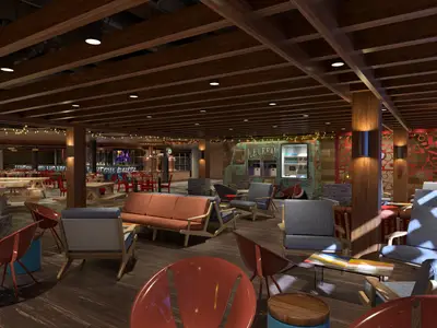 Eine moderne Lounge auf der Carnival Jubilee mit bequemen Sesseln, Sofas und Holzbalkendecke. Ein Eissalon im Foodtruck-Stil ist sichtbar.
