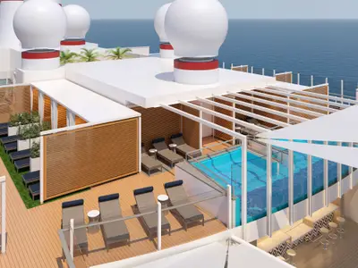 Vogelperspektive auf ein modernes Pooldeck der Carnival Jubilee mit blauen Pools, vielen Liegestühlen, privaten Cabanas und einer Bar. Das Meer ist im Hintergrund sichtbar.