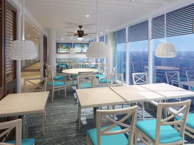 Ein lichtdurchflutetes Restaurant auf der Carnival Jubilee mit Holztischen, Stühlen mit türkisen Polstern und großen Fenstern zum Meer. Die Einrichtung ist modern und freundlich.
