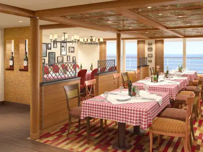 Ein leeres Restaurant auf der Carnival Sunrise mit rot-weiß karierten Tischdecken, elegant gedeckten Tischen, Holzböden und großen Fenstern, die den Blick auf das offene Meer freigeben.