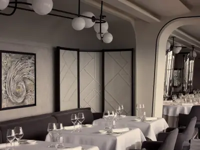 Fein gedeckte Tische mit Gläsern und Kunst an den Wänden im stilvollen Restaurant an Bord der Explora II.