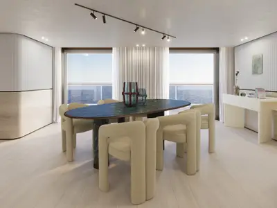 Elegante Owner's Residence an Bord der Explora III mit einem ovalen Marmortisch, stilvollen Stühlen und Meeresblick.