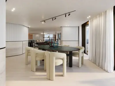 Eleganter Essbereich der Owner's Residence an Bord der Explora III mit grünem Marmortisch und cremefarbenen Stühlen.