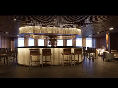 Elegante Bar-Lounge an Bord der Norwegian Aqua. Eine zentrale, beleuchtete ovale Bar mit Flaschenregal und Hockern. Moderne Holzakzente und indirekte Beleuchtung schaffen ein luxuriöses Ambiente.