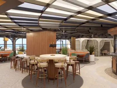 Indulge Food Hall an Bord der Norwegian Aqua. Bartresen mit hohen Stühlen, Sitzbereiche mit Tischen, Bänken und bunten Stühlen. Große Fensterfronten mit Meerblick.