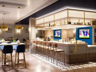 Rendering der The Local Bar & Grill an Bord der Norwegian Encore. Eine moderne Bar-Lounge mit Theke, Hockern, Tischen, Stühlen und Bildschirmen, die ein Fußballspiel zeigen.