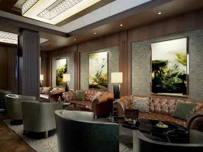 Luxuriöse Humidor Lounge der Norwegian Encore mit Ledersofas, Sesseln und Kunstwerken. Eine elegante, warme Atmosphäre.