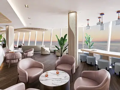 Moderne Bar-Lounge an Bord der Norwegian Luna. Große Fenster bieten weiten Meerblick bei Sonnenuntergang. Helle Sessel, Holzböden, Pflanzen und stilvolle Lichtobjekte prägen das Ambiente. Cocktails auf Marmortischen.