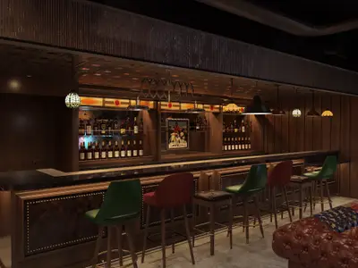Innenansicht der Syd Norman's Bar an Bord der Norwegian Luna. Die Bar hat eine dunkle Holzvertäfelung, eine lange Theke mit Hockern und Regalwände voller Flaschen. Verschiedene Hängelampen sorgen für eine warme Atmosphäre.