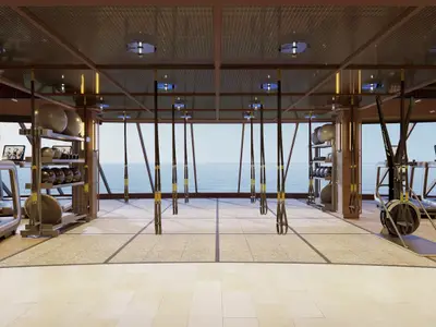 Ein helles, modernes Fitnesscenter an Bord der Norwegian Luna mit raumhohen Fenstern und weitem Meerblick. Laufbaender, TRX-Baender und eine Hantelbank sind erkennbar.