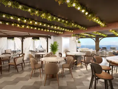 Eine elegante Restaurantansicht an Bord der Norwegian Luna mit zahlreichen Tischen und Stühlen, Deckenbegrünung und Panoramafenstern zum Meer.
