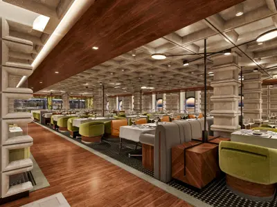 Innenansicht des modernen Cagney's Steakhouse an Bord der Norwegian Luna mit Tischen, bequemen Stühlen in Grün und Orange, und einer einzigartigen Deckenstruktur.
